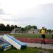 Referees wait out a storm during the game between Huron and Skyline on Thursday, May 30. Daniel Brenner I AnnArbor.com